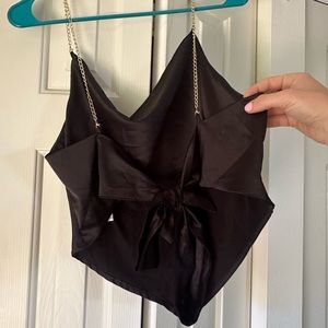Nasty Gal Black silk top, ties in the back, cute gold “straps”